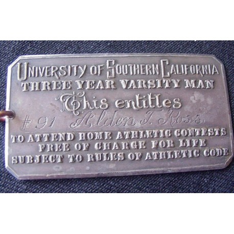 Silver lifetime admission card for USC athletic events.